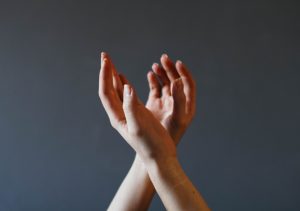 hands on a gray background